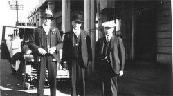 Three men on street in Hastings 1931